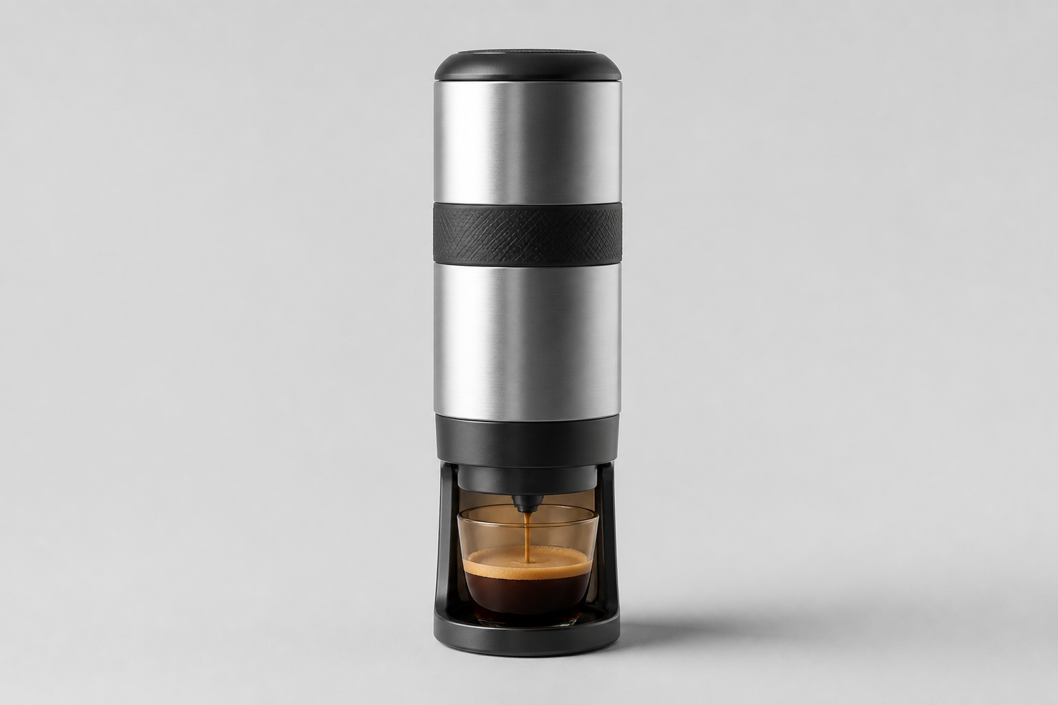 Portable espresso maker on a neutral studio background