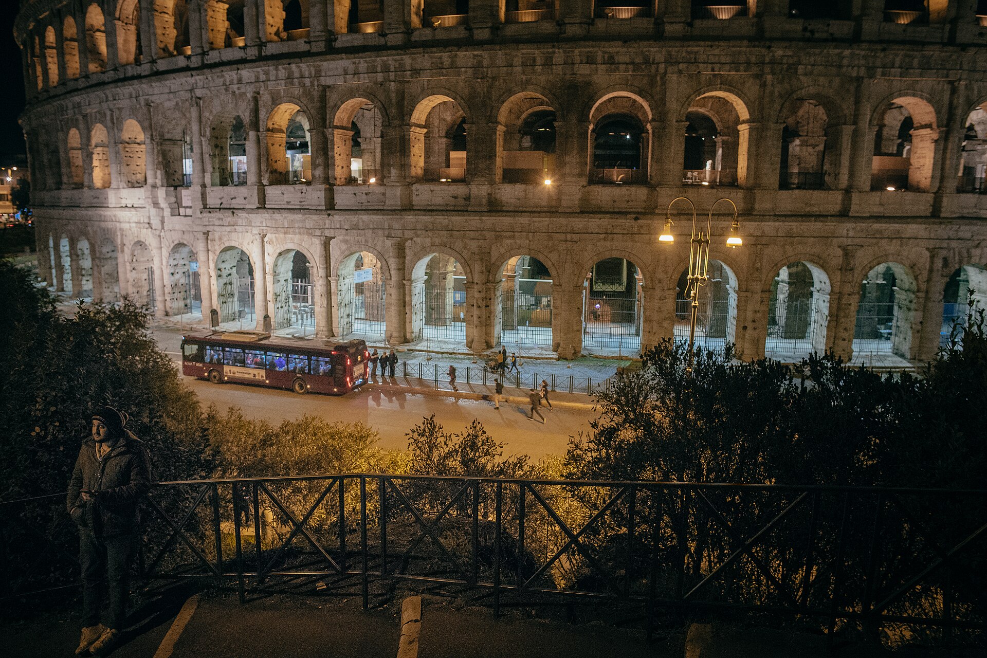 Illuminated exterior arches of the Colosseum in Rome, Italy